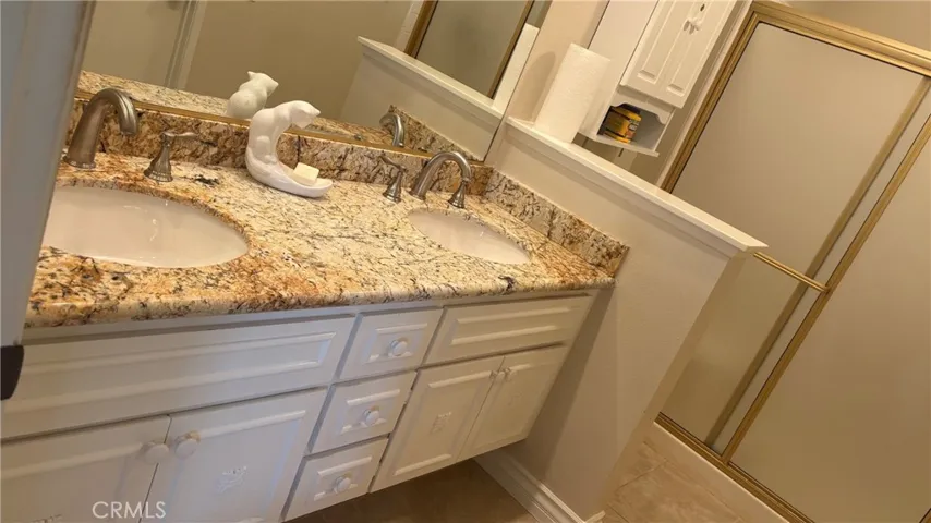 master bathprimary bathroom with a double vanity.
