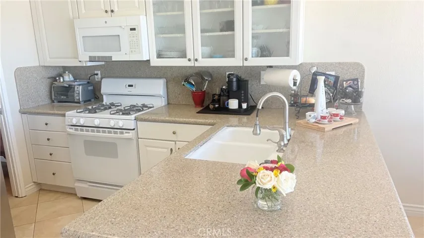 Kitchen with granite countertops.