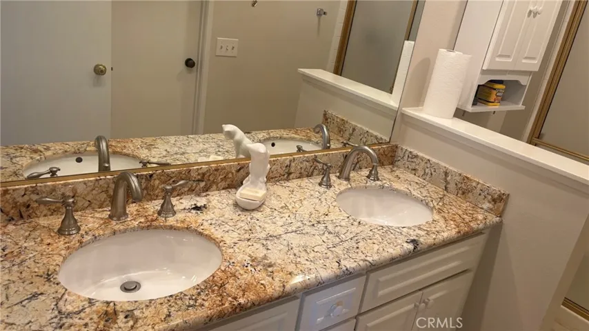 primary bathroom with a double vanity.