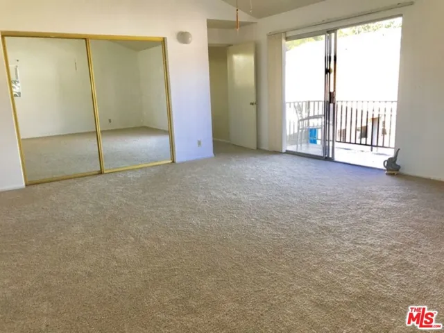 spacious primary suite with ba