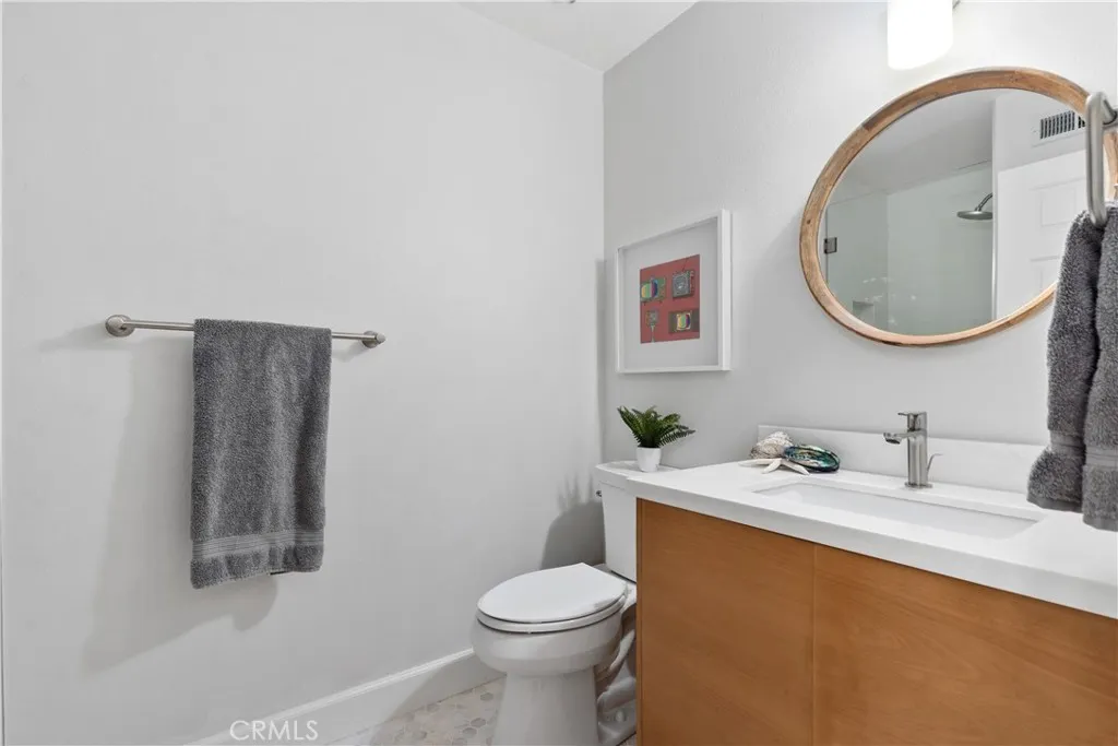 Remodeled downstairs bathroom with soft tones and gorgeous floating vanity and tile!