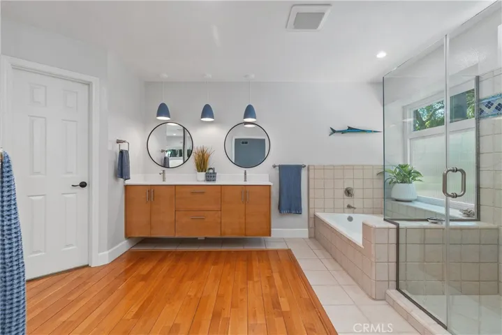 Primary bath eloquently appointed with floating dual vanity!