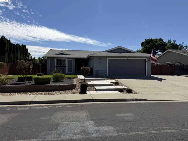 Single-story residence featuring a two-car garage and a concrete driveway
