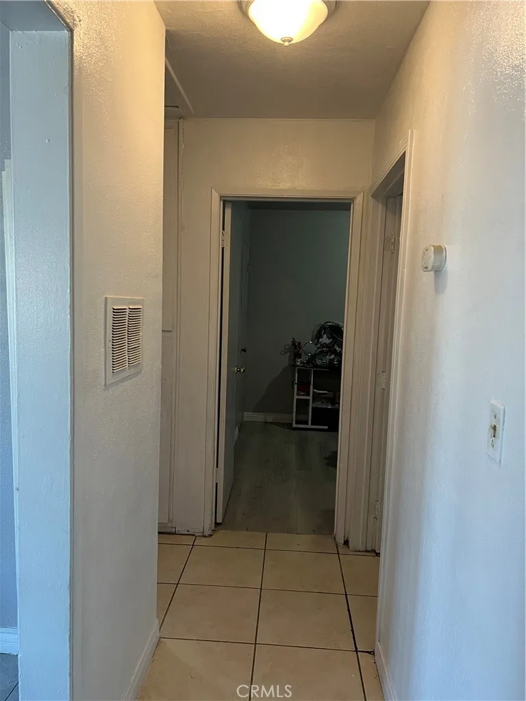 Hall leading up to one bedroom