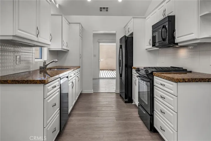 Kitchen opens up to Dining Area,Living Room and the Family Room.
