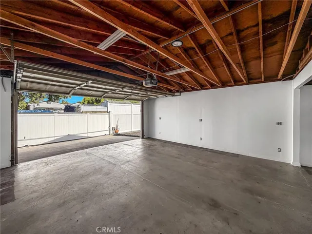 Gated Garage with access from the rear Alley.