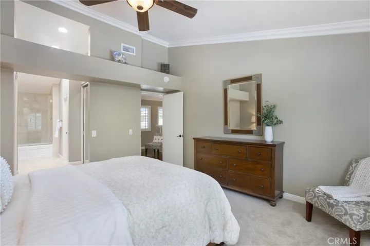 Ceiling fan, crown moulding and dual closets