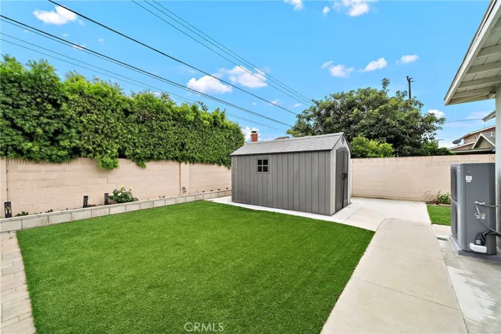 Storage Shed, Artificial Lawn, Block Wall Fencing