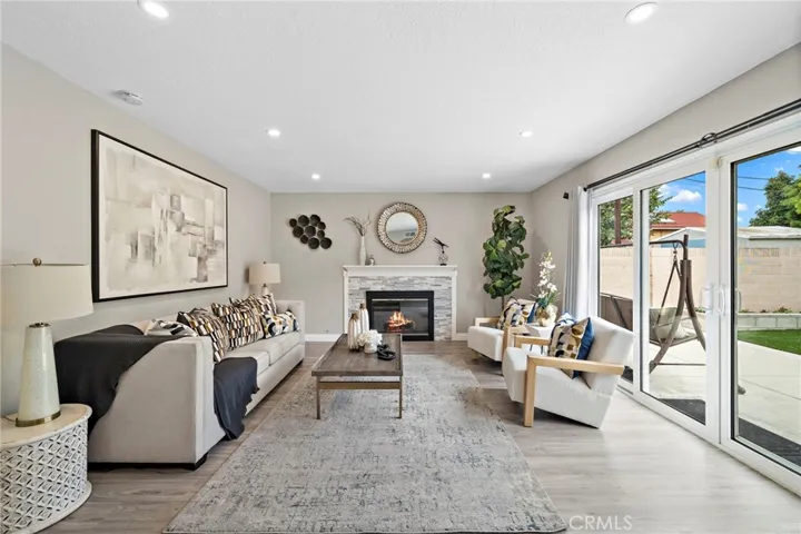 Stacked Stone Fireplace, Extensive Recessed Lighting, Dual Pane Windows and Sliders