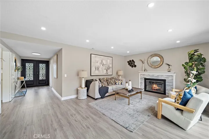 Double Door Entry, Luxury Plank Vinyl Flooring, Formal Living Room with Fireplace