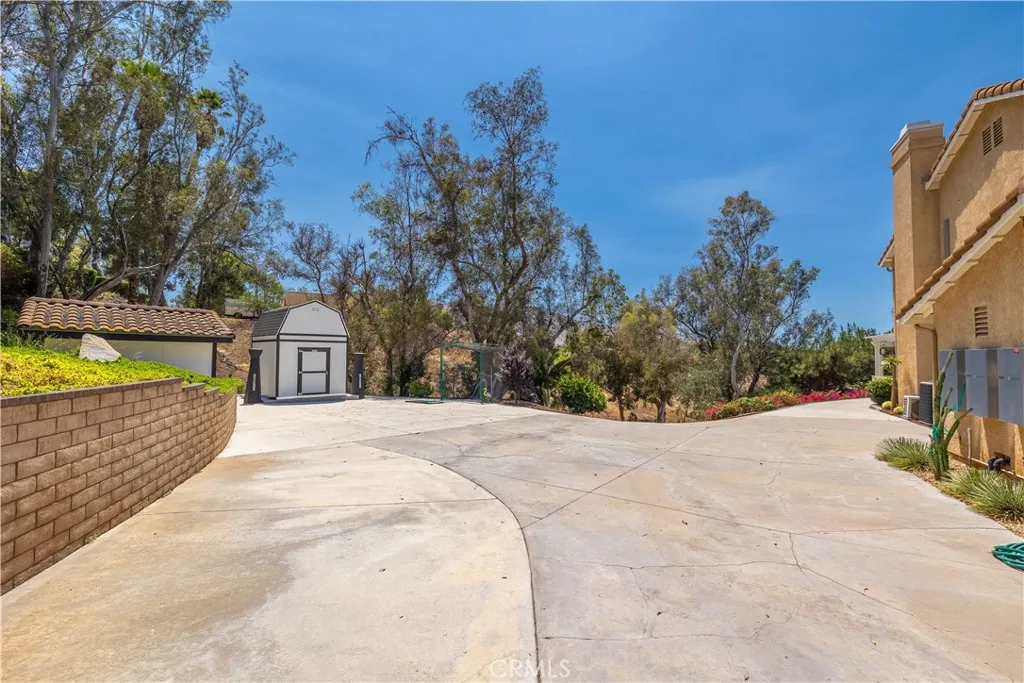 Extra Finished Driveway Area for RV hookup, 2 Sheds and more options!