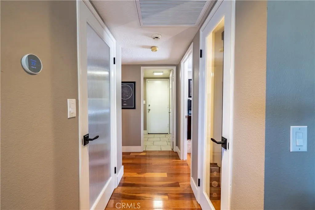 Downstairs Hallway Area to Main Floor Bedroom and Bathroom