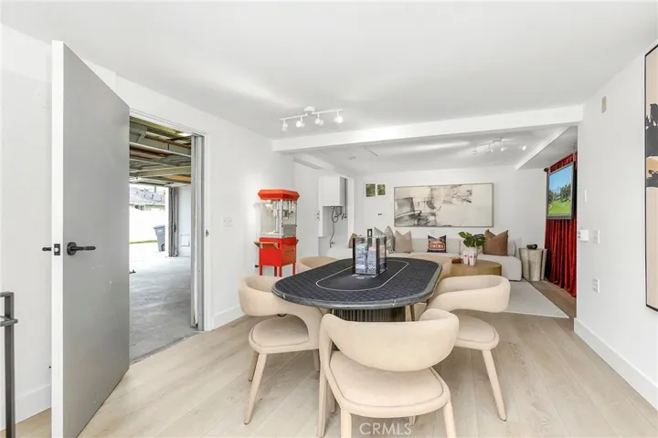 AI Edited TV Pic -Flex Space/Bonus Room off of Garage  - Sliding Wall and a Separate Door to Garage are OPEN to Garage in photo (Potential ADU?)