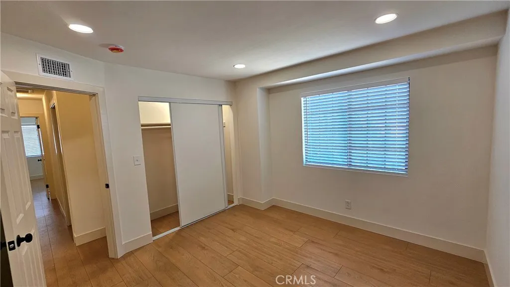 Bedroom 2 with view down hallway