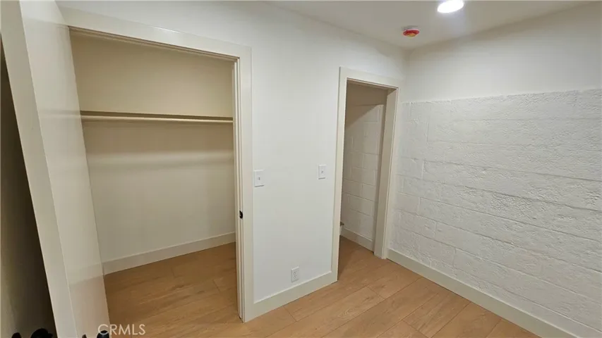 Bonus room closet/storage and entry to stairs - off garage
