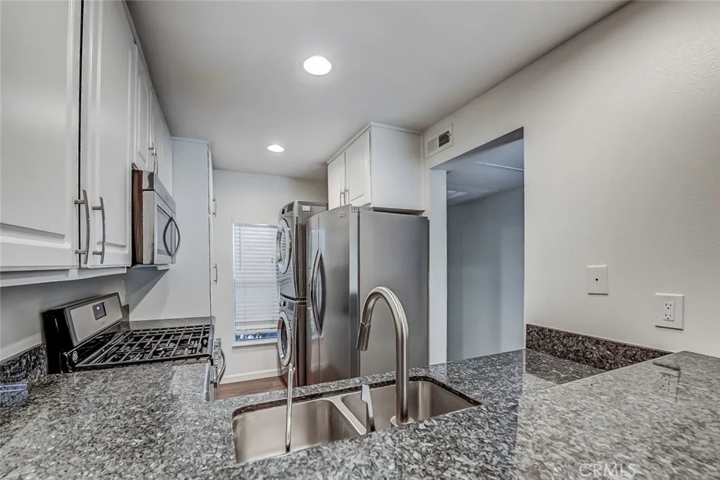 Kitchen with stackable washer and dryer