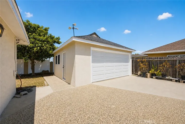 carport + detached garage + extended driveway