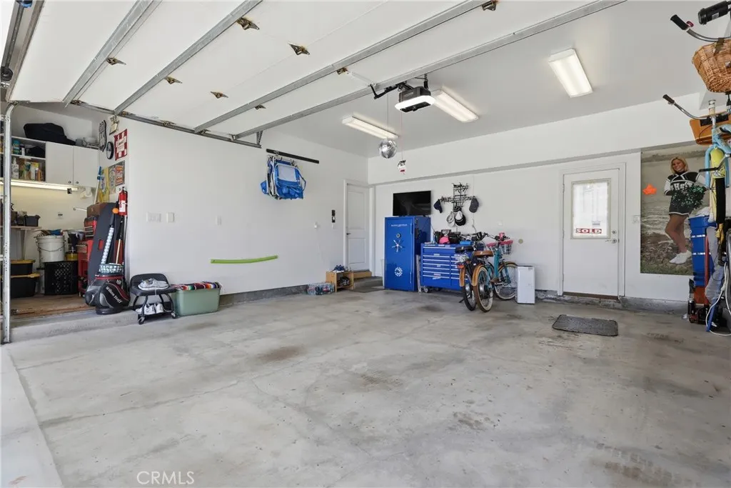 Workshop area on left of garage, nice overhead lighting. Workshop area on left of garage, nice overhead lighting.