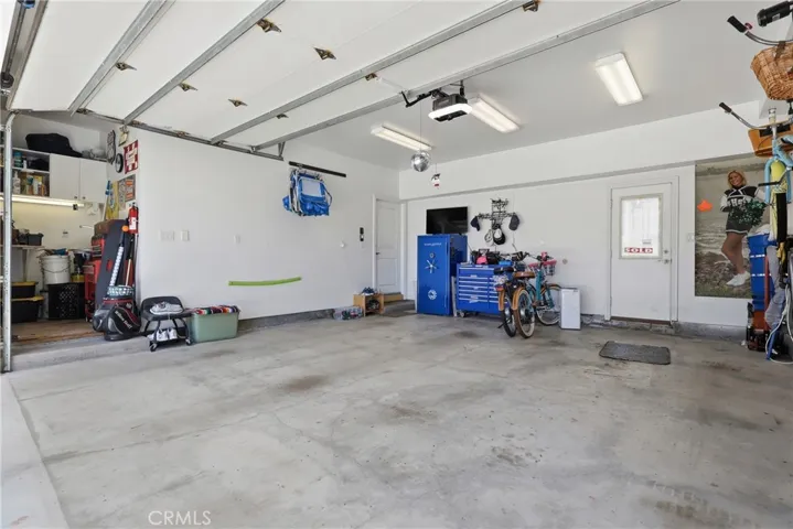 Workshop area on left of garage, nice overhead lighting.