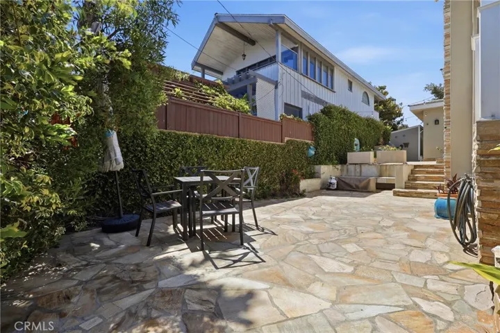 Lower patio - with a view to fountain, BBQ and upper patio.