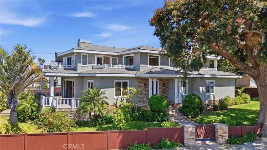 Proud corner location with private grass yard and lush landscaping.