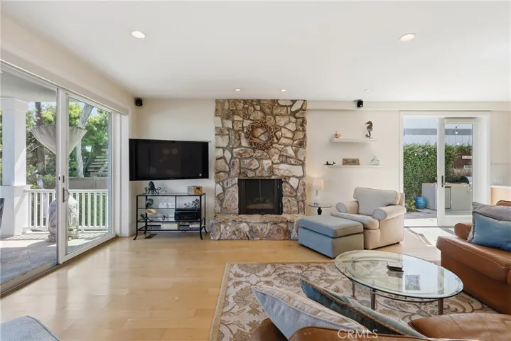 Inviting fireplace, recessed lighting and gleaming hardwood floors!