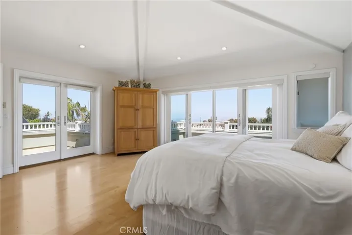 Large primary suite with dual balconies and sweeping views - day or night!