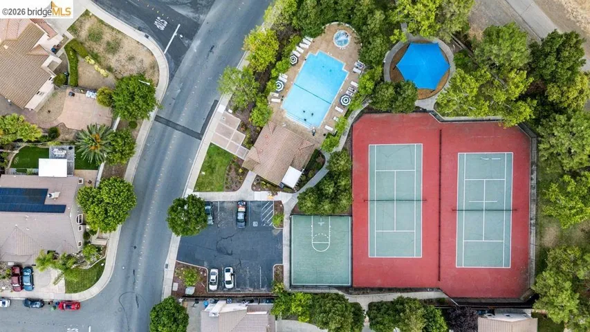 Community amenities featuring a swimming pool, spa, two tennis courts, and a basketball court