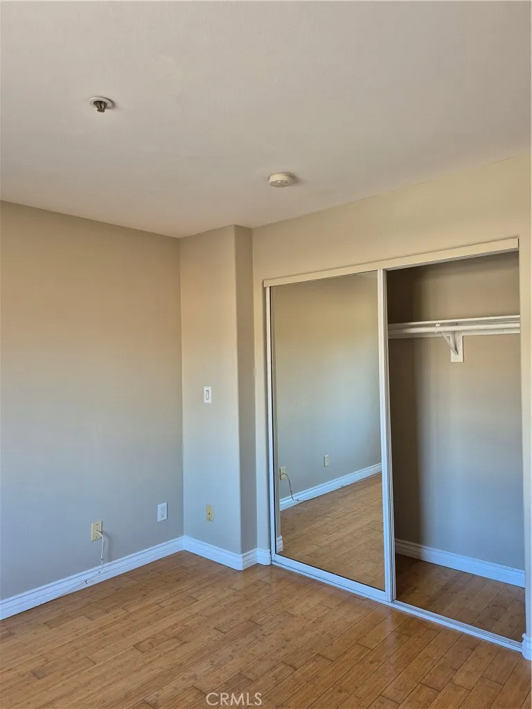 2nd bedroom with mirrored wall wardrobe