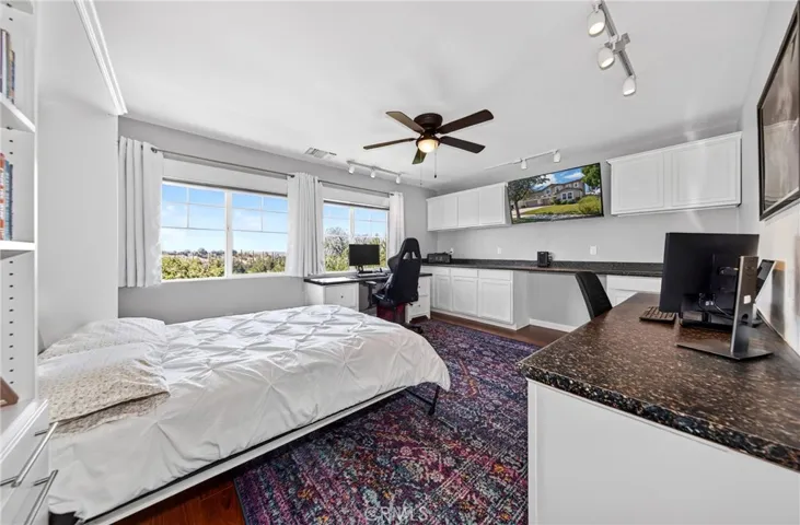 Office/bedroom with Murphy bed for added convenience and flexible space usage.