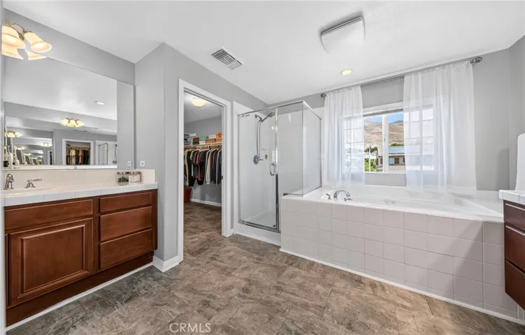 Primary bathroom with walk in closet