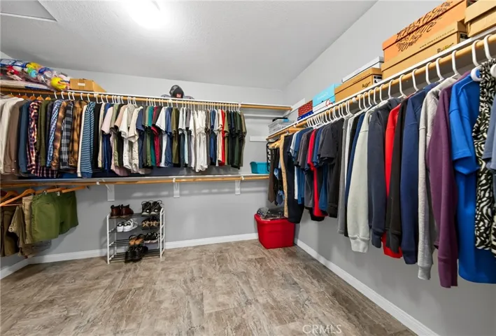 Walk-in closet in primary bathroom