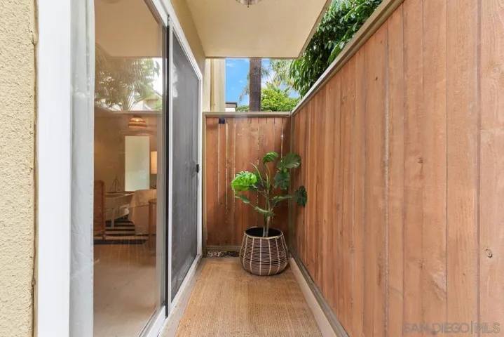 Small patio off living room leading to spacious, private back patio.