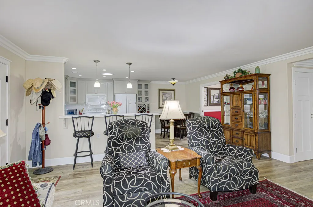 Another view of the living room looking towards the kitchen and dining area.