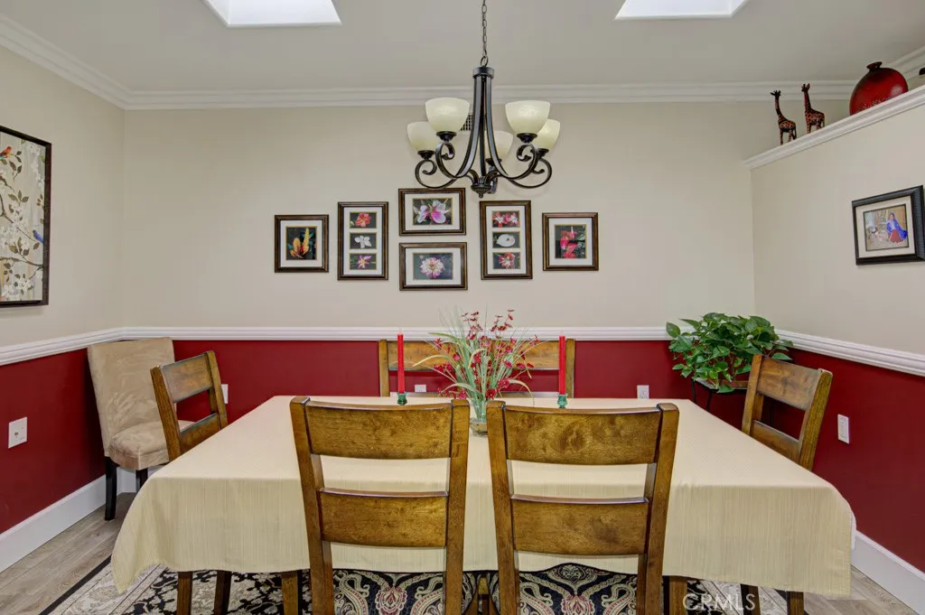 Central atrium has been fully-enclosed and currently serves as a dining room. This versatile space is well lit with multiple skylights and could alternatively serve as a home office, workout area or arts & crafts studio.