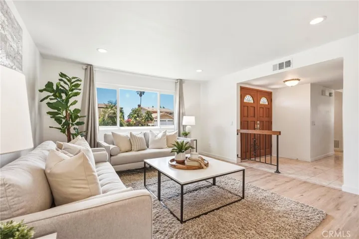 Spacious living room with brand new windows