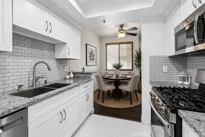 Virtually Staged Dining Kitchen 17722 Sergio Cir, # 102 Huntington Beach, CA 92647