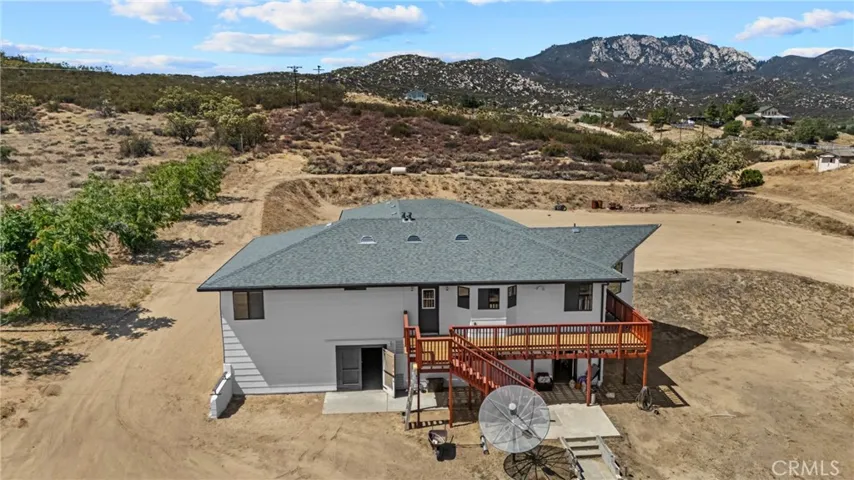 Southside of home showing basement entrance