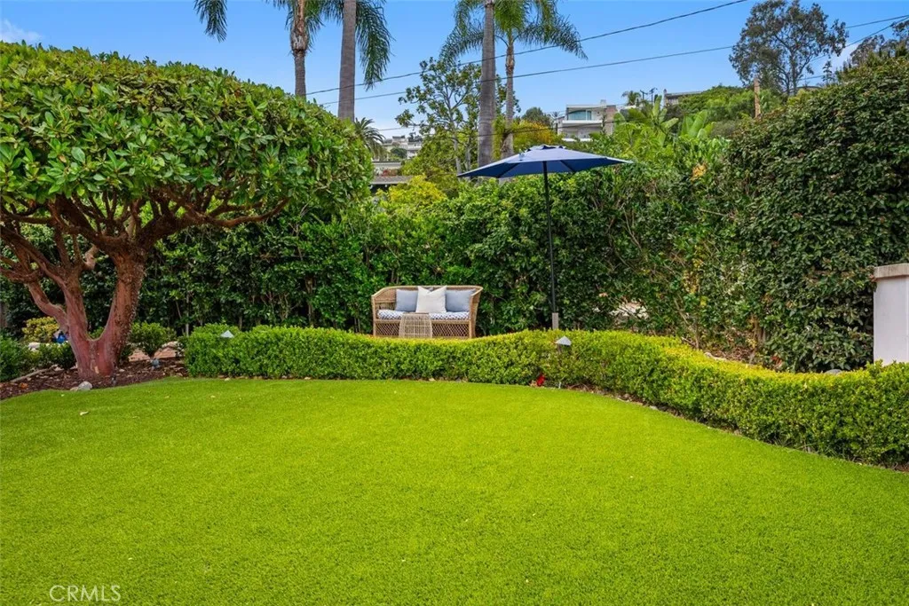 Front lawn with artificial grass, easy to maintain.