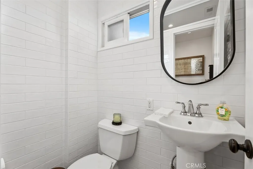 Powder room just off the kitchen. Powder room just off the kitchen.