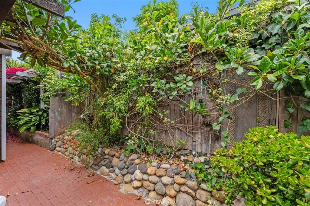 Mature foliage can be seen throughout the yard. Mature foliage can be seen throughout the yard.