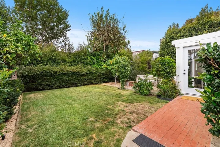 Lot size is approx. 7,500 square feet and look at this backyard complete with a lemon tree!