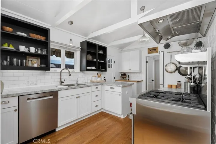 Upgraded kitchen with top of the line appliances and Brazilian granite countertops.