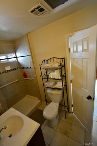 Bathroom is accessible from both bedrooms.