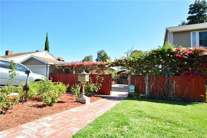 Charming Entry to side yard where this Guest House is located