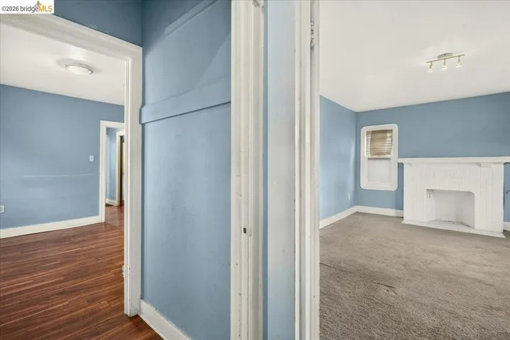 Blue-painted interior with white trim and a white decorative fireplace