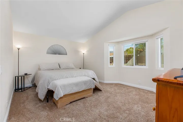 Primary bedroom w/ lovely views of the backyard!