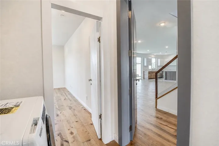 Washer/Dryer Combo and main out entrance to the right