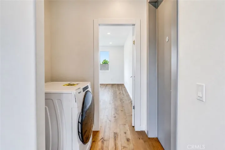 Washer/Dryer Combo and main out entrance to the right
