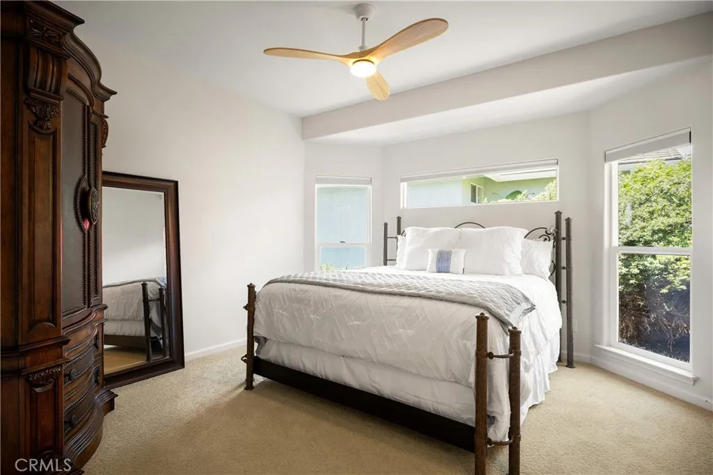 The primary bedroom filled with light
